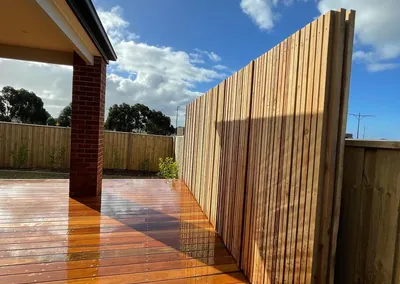 Hardwood deck and timber privacy screen at a covered alfresco